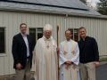 Bishop, Rector and green team members in front of St. Paul's solar panels for Blessing of the Solar Panels.