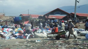 Street scene with piles of discarded items.