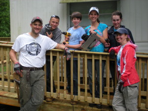 St. Paul's adults and youth with tools on a newly rebuilt porch. Mission Trip 2013